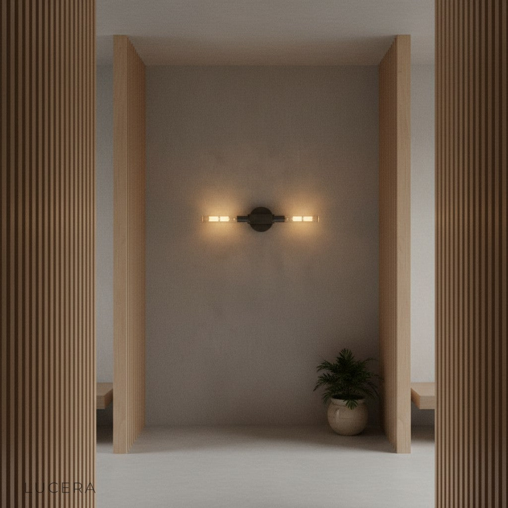 Ravello brass linear sconce above minimalist entryway console table
