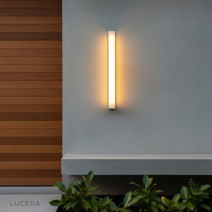 aesthetic close-up of Varenna lamp glowing at dusk with marble veins highlighted