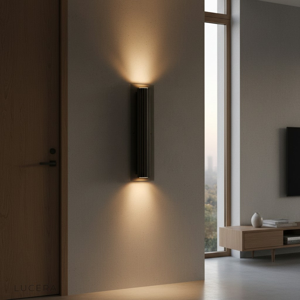 Loano copper and black sconce lighting up reading nook with warm cozy atmosphere