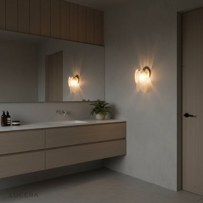 Albenga feather wall lamp in serene reading nook with textured wall