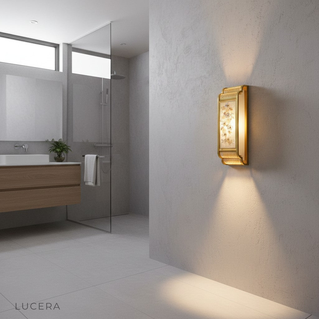Bordure wall lamp beside bed in cozy bedroom with soft cloth shade glowing warmly