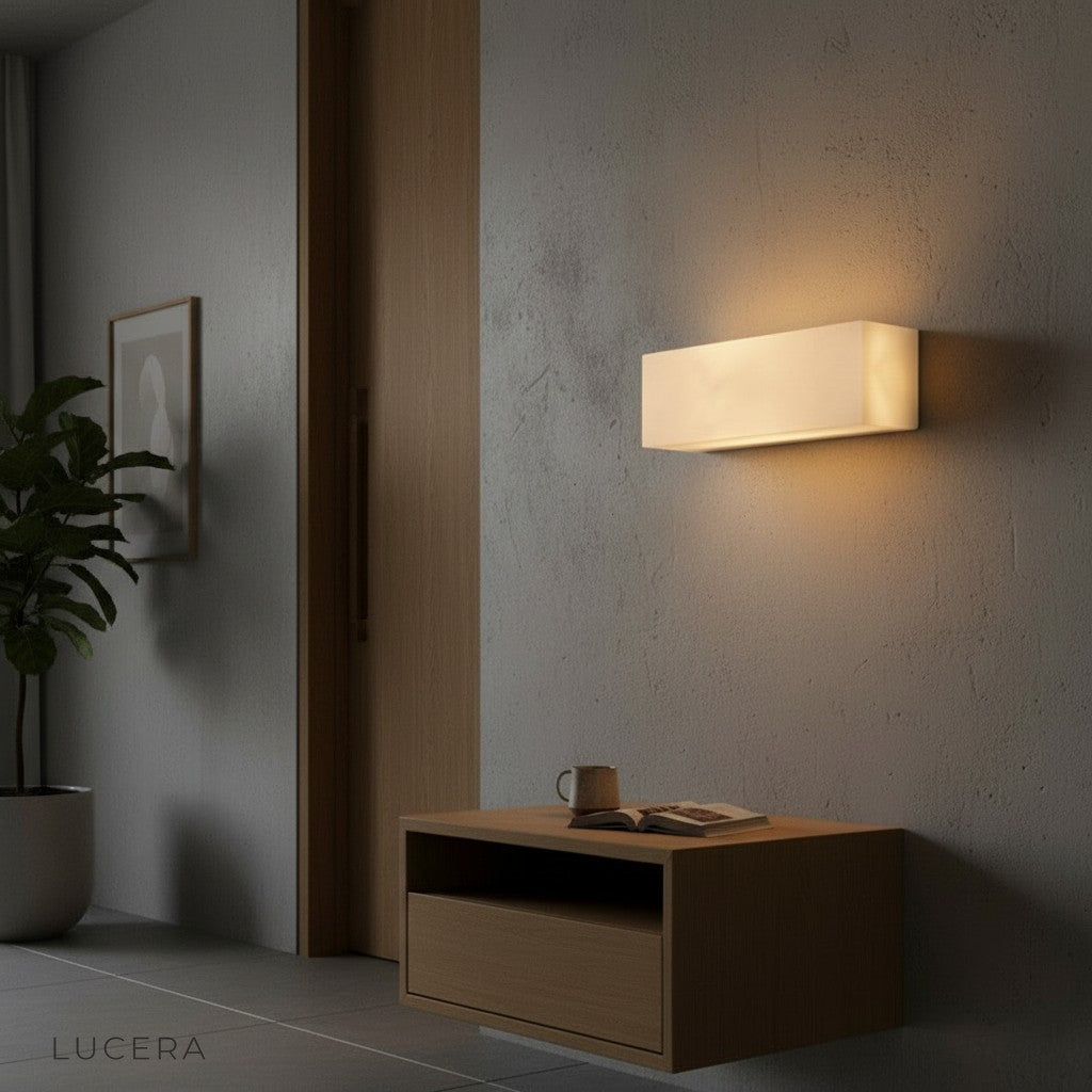 Enjoue marble wall lamp styled above a bathroom vanity with soft ambient lighting