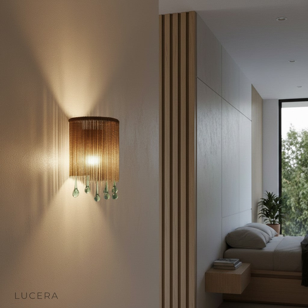 ambient nighttime shot of Mesure crystal sconce casting sparkling glow on bedroom wall