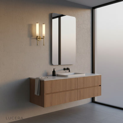 Outre wall lamp glowing warmly in stylish reading nook with bookshelf