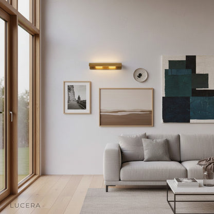 Tresse luxury sconce above bedside table with soft warm lighting