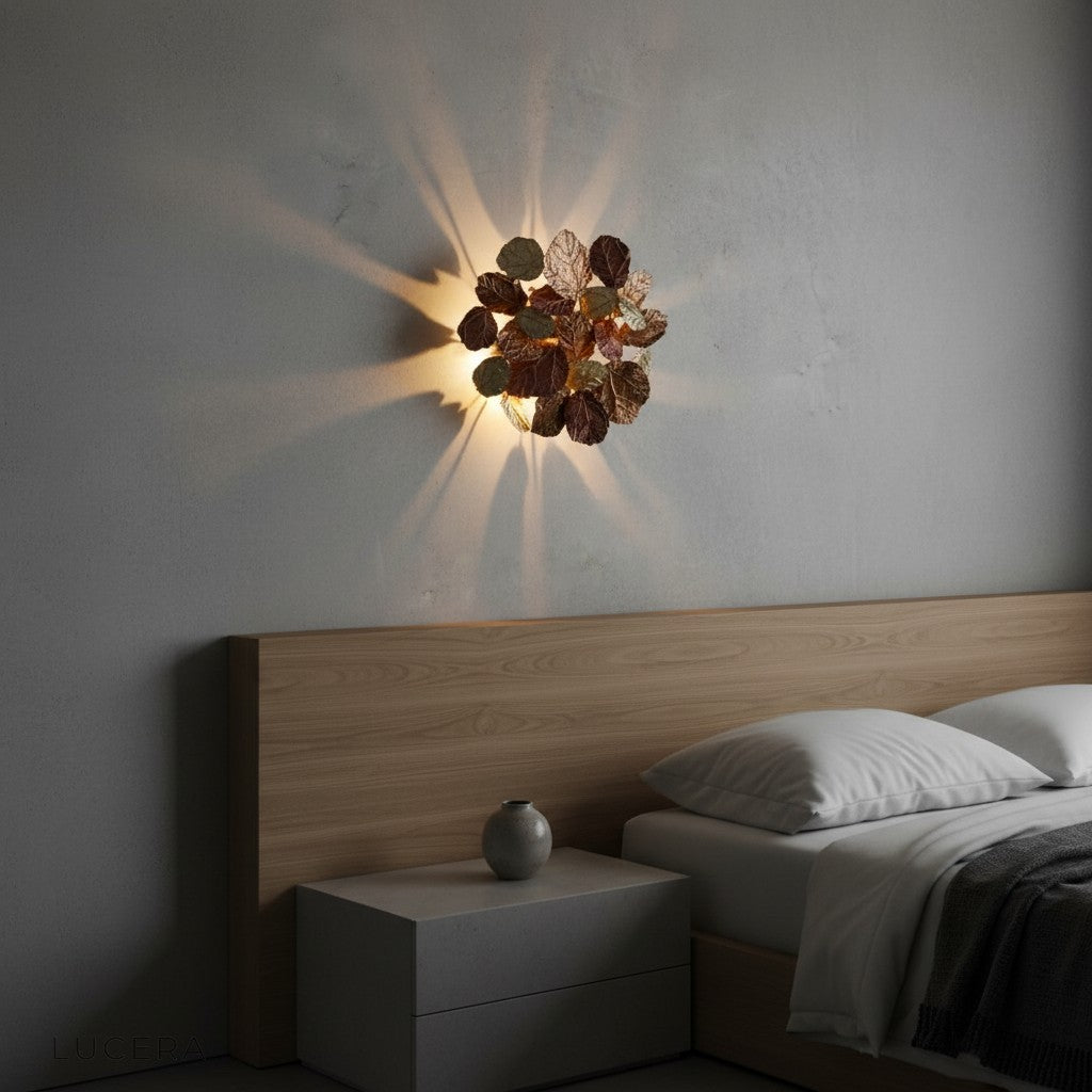 Yssel Maple Leaves Wall Lamp with soft ambient glow in a minimalist entryway