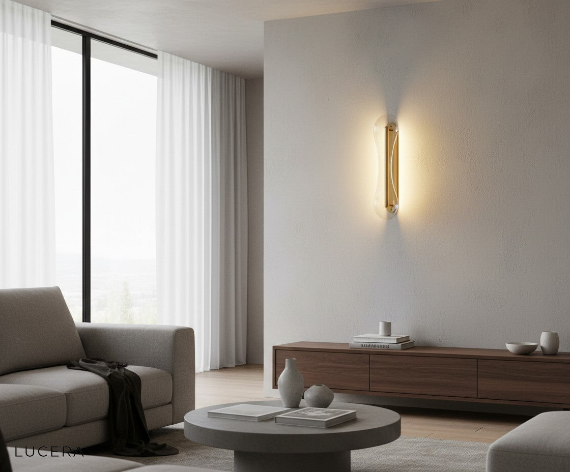 spire glass wall lamp with cool white light in contemporary hallway setting