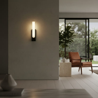Nighttime shot of marble lamp glowing softly in minimalist lounge