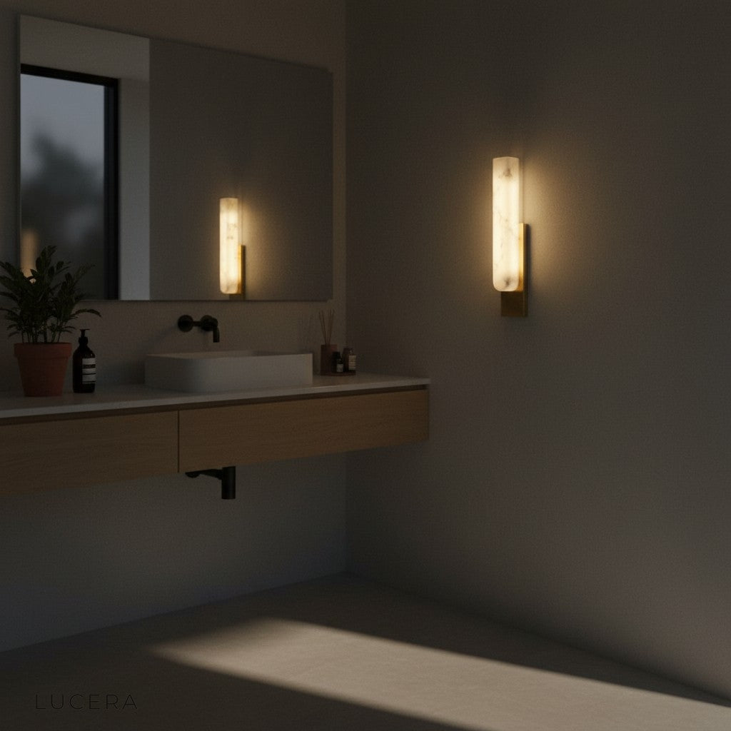 Sculptural marble lamp against dark wall for dramatic contrast