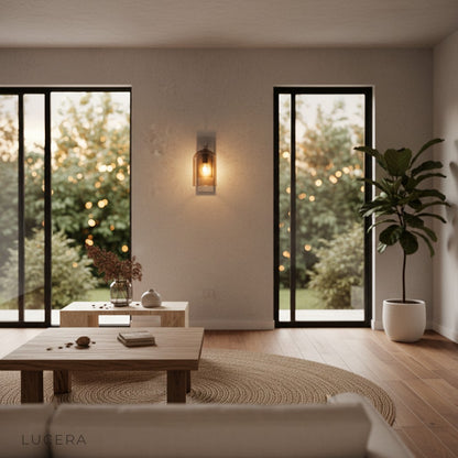 elegant glass and iron wall sconce paired with wooden furniture in bright airy living space