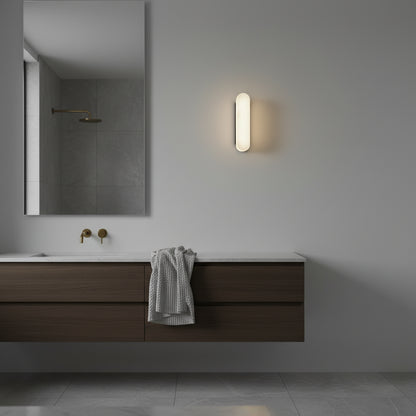 studio shot of Abacus marble wall lamp showing natural veining and brass details