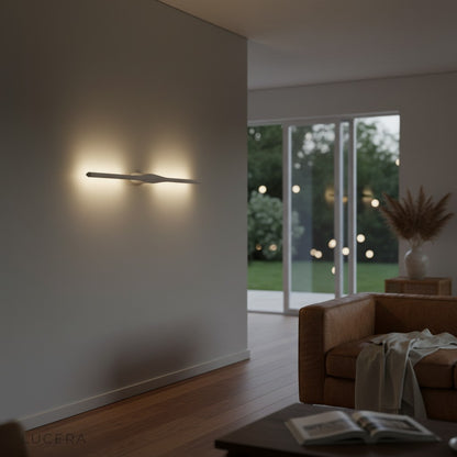 Elan wall lamp in a high-tech style living room with bookshelf and warm accent light