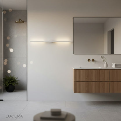 Elan wall lamp in a Nordic-inspired reading nook with warm light and minimal decor