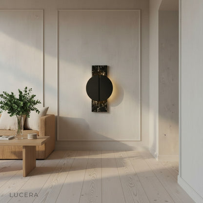 elegant wall lamp with warm glow highlighting marble surface and copper details
