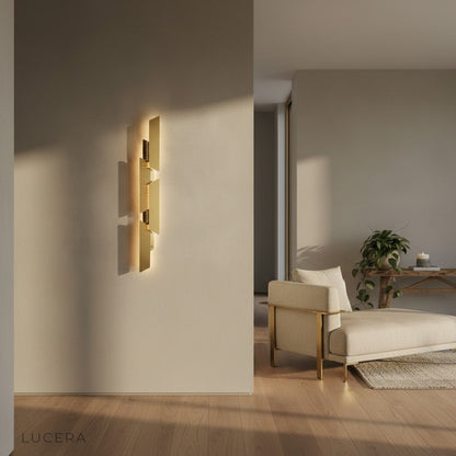 Myelin copper sconce glowing against textured concrete wall in industrial loft
