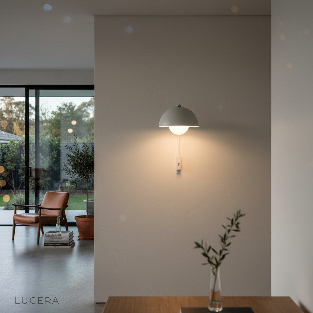 Coronal Nordic wall lamp in modern living room with bookshelf and plant