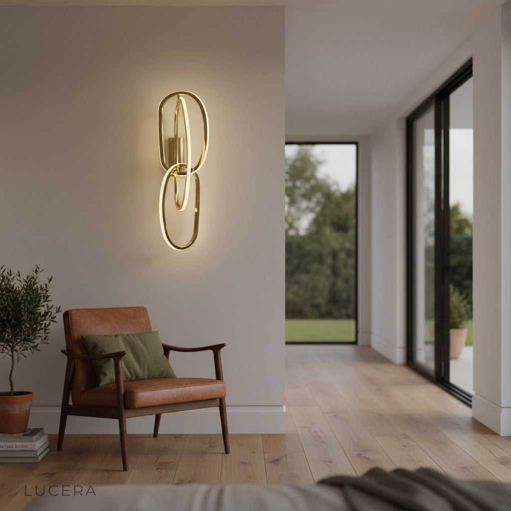 contemporary wall sconce illuminating dining room wall with soft golden glow