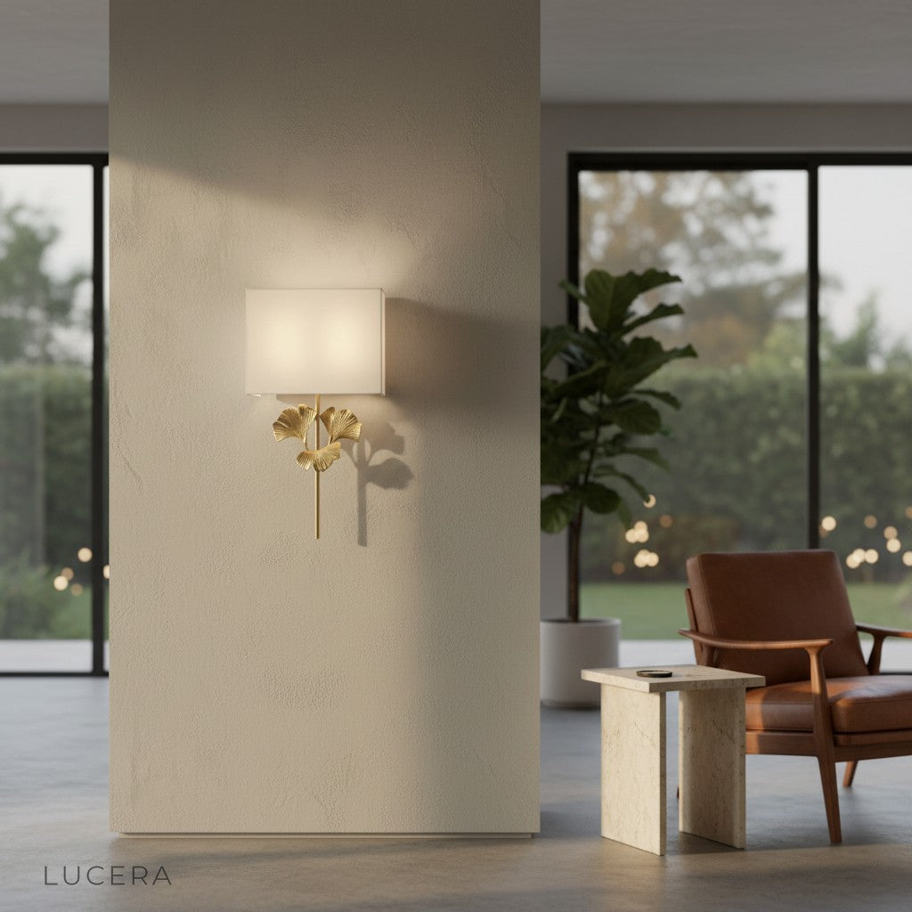 front view of ginkgo leaf wall sconce on clean white wall