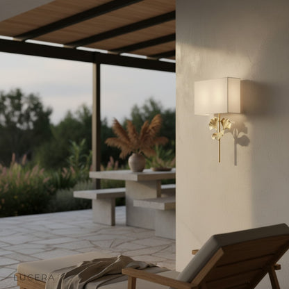 warm ambient light from ginkgo wall lamp in hallway at dusk