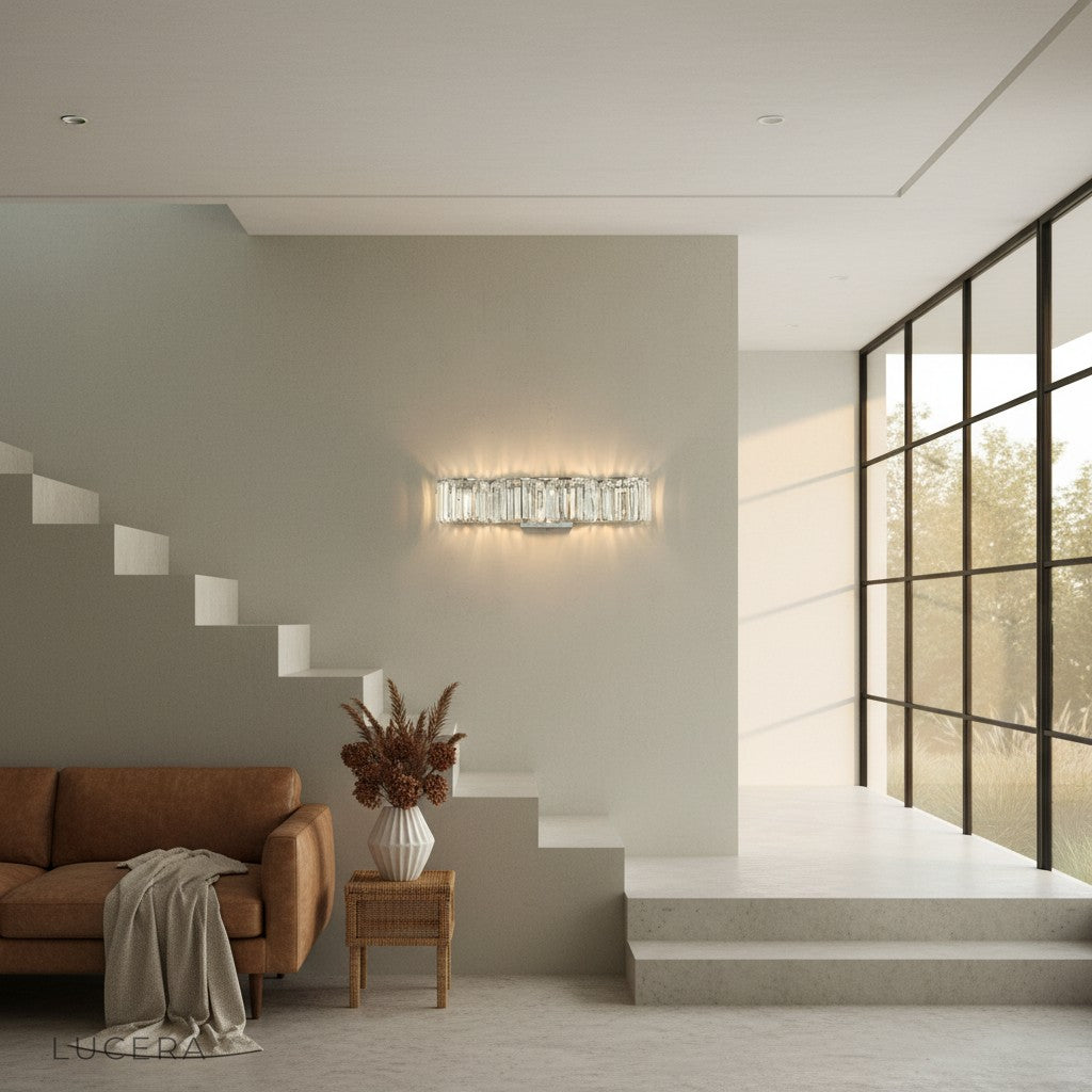 Close-up of the Vibrato sconce's crystal cluster reflecting warm light in a dim room