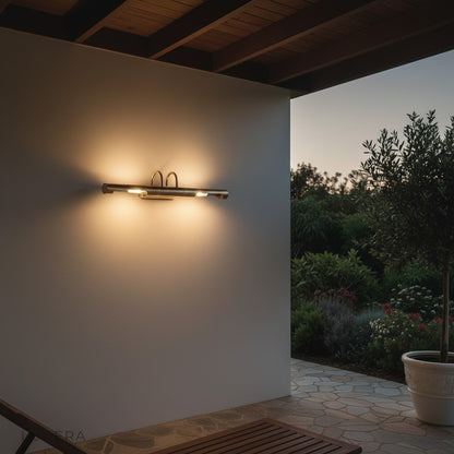 Ricochet Long Copper Wall Lamp in bedroom setting creating cozy, space-expanding illumination