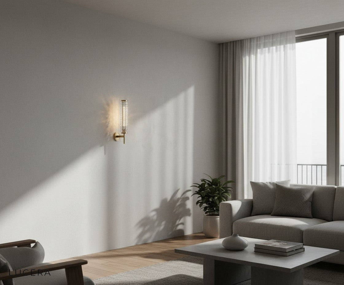 Solo copper sconce illuminating a dark accent wall in a stylish entryway