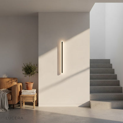Wall lamp glowing softly in dark modern dining room for ambient accent lighting
