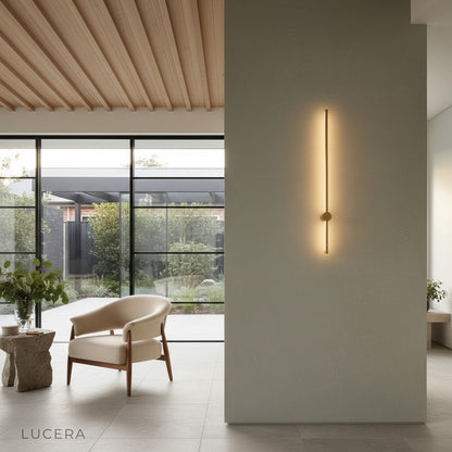 Rinforzando minimalist wall lamp glowing softly in a dark modern lounge