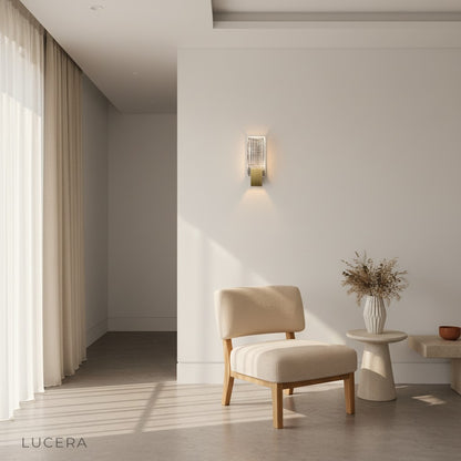 Slargando sconce illuminating dark wall with dramatic crystal light play at night