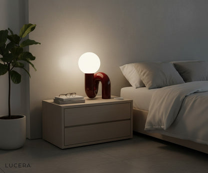 Precipitando pink lamp on dining table setting with warm sunset light through window