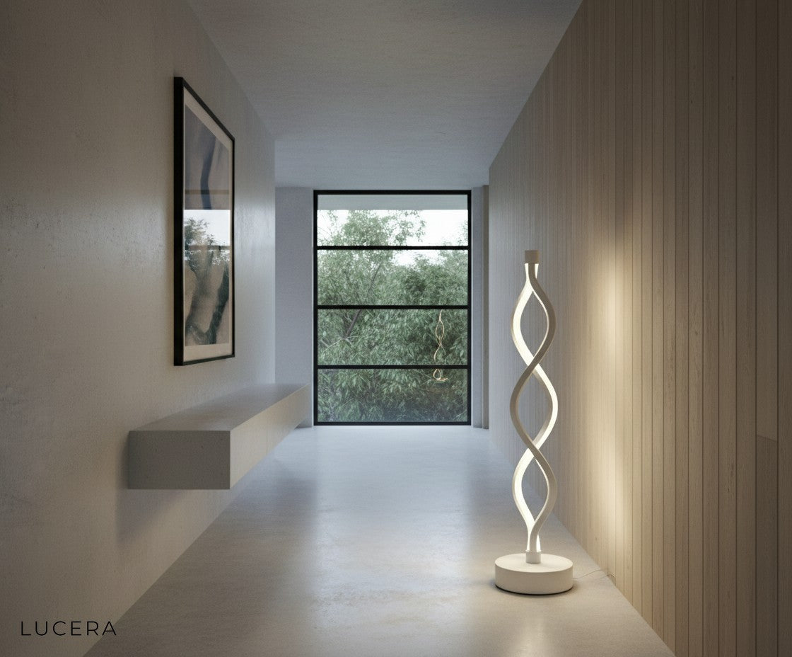 Cool white LED spiral lamp on concrete floor near window, industrial loft setting