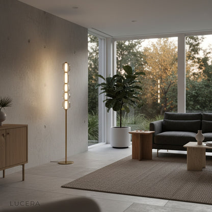 Morpheus Floor Lamp illuminated in dark lounge with glass orbs creating cozy atmosphere