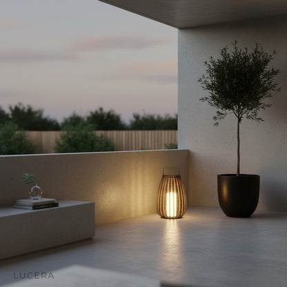 Layman lamp casting ambient light along a stone garden path at night