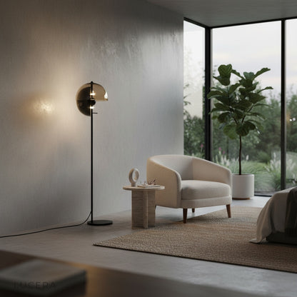 Oubliette Floor Lamp with lacquered iron shade casting soft indirect glow