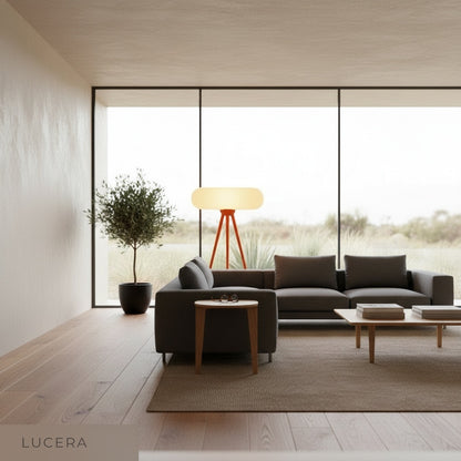 Juncture Floor Lamp casting soft ambient light in cozy bedroom at dusk