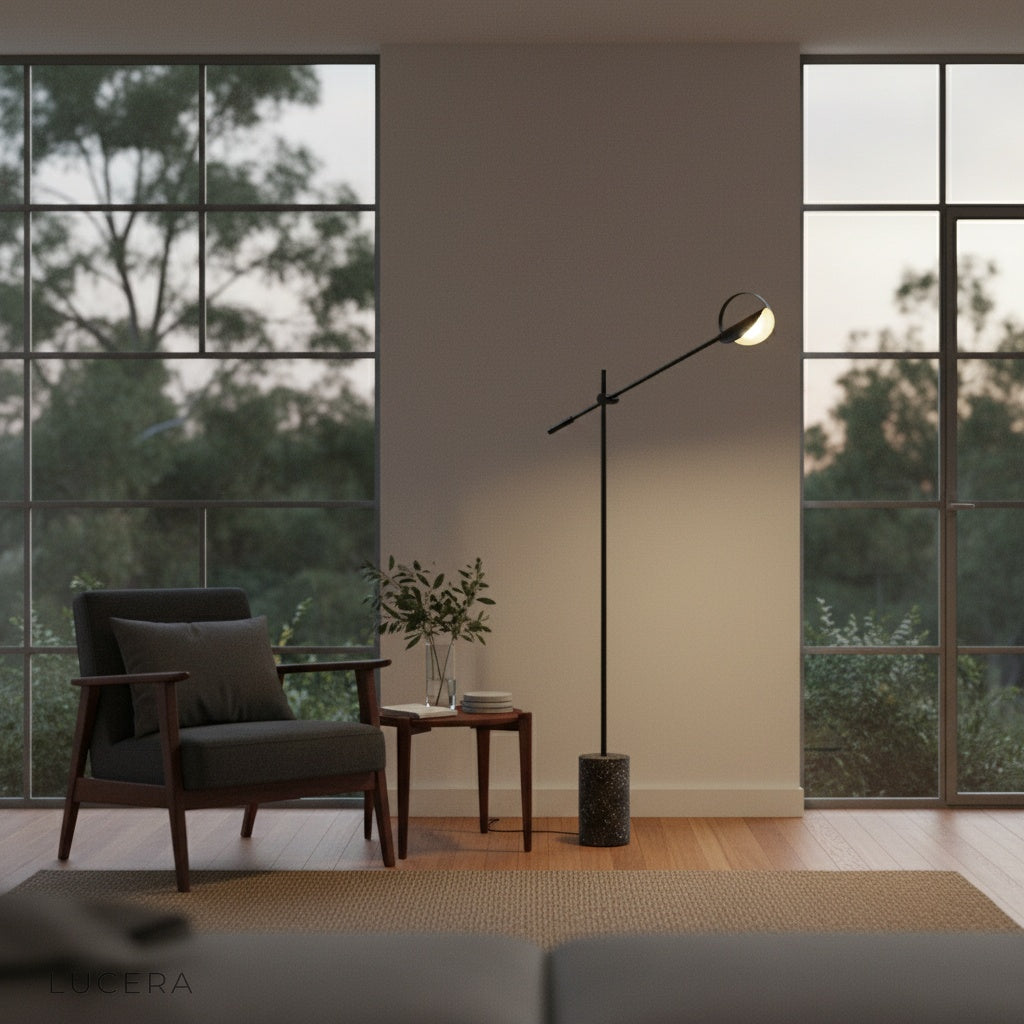 Close-up of textured terrazzo base and matte black iron joint on Memento Floor Lamp