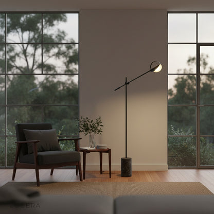 Close-up of textured terrazzo base and matte black iron joint on Memento Floor Lamp
