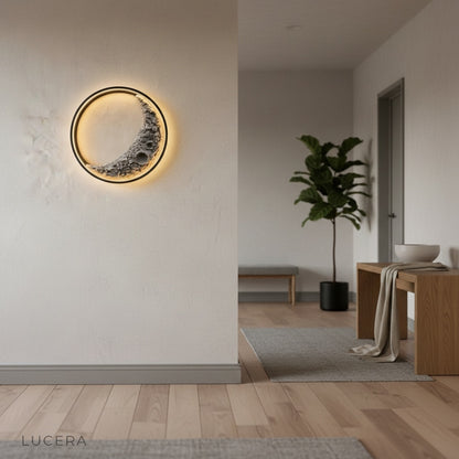 Close-up of Haldor Moon Wall Lamp crater texture and halo light ring in black iron