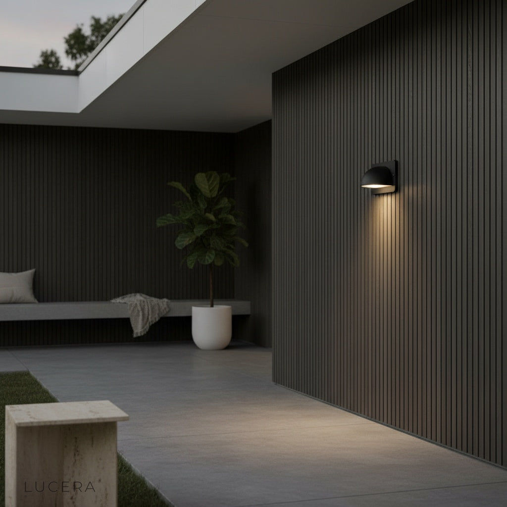 close-up of brushed aluminum finish and frosted polycarbonate diffuser on wall lamp
