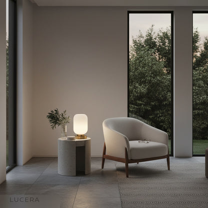 ambient nighttime shot of ribbed glass lamp casting patterned light on wall