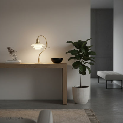 Close-up of Jardin Table Lamp frosted glass shade revealing soft warm light diffusion and brushed metal finish