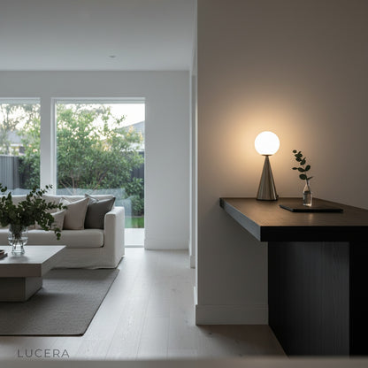 hieroglyph table lamp casting warm ambient light on bar counter at night