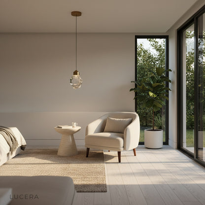 cristal pendant light hanging over kitchen island with soft natural daylight