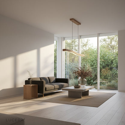 Tenebrous pendant light in warm ambient glow above a dining table with natural decor
