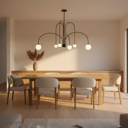 Unico Chandelier hanging in bright minimalist room with high ceiling