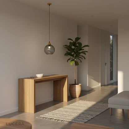 Kronos pendant light multi-head configuration in studio, three glass shades aligned