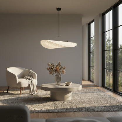 Eridanus pendant light at dusk in a contemporary loft with city window view
