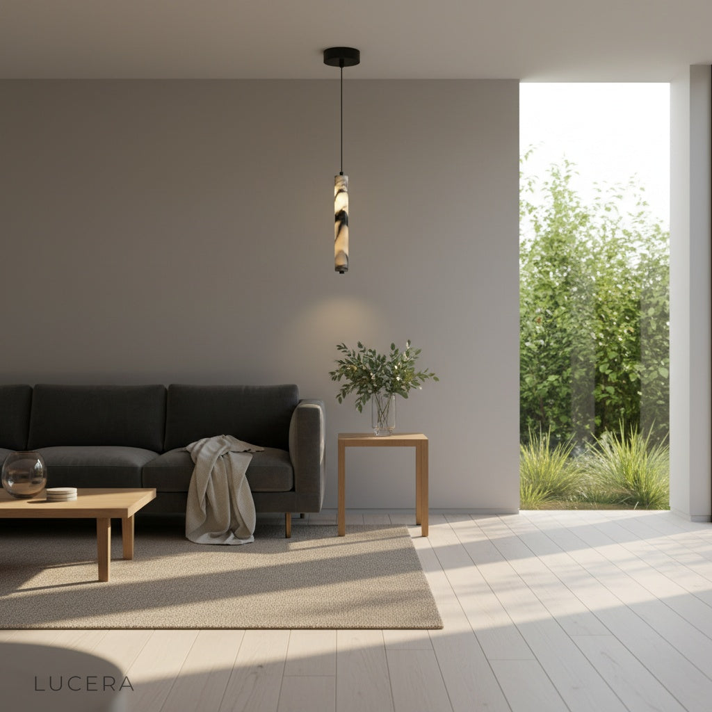 sculptural marble pendant light hanging over a kitchen island with soft ambient shadows