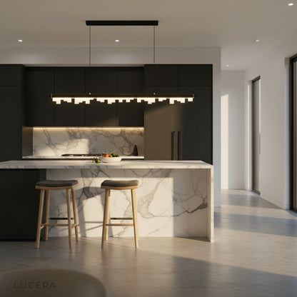 Nighttime lifestyle shot of the Lucera Fascinating Pendant Light glowing above a modern bar counter