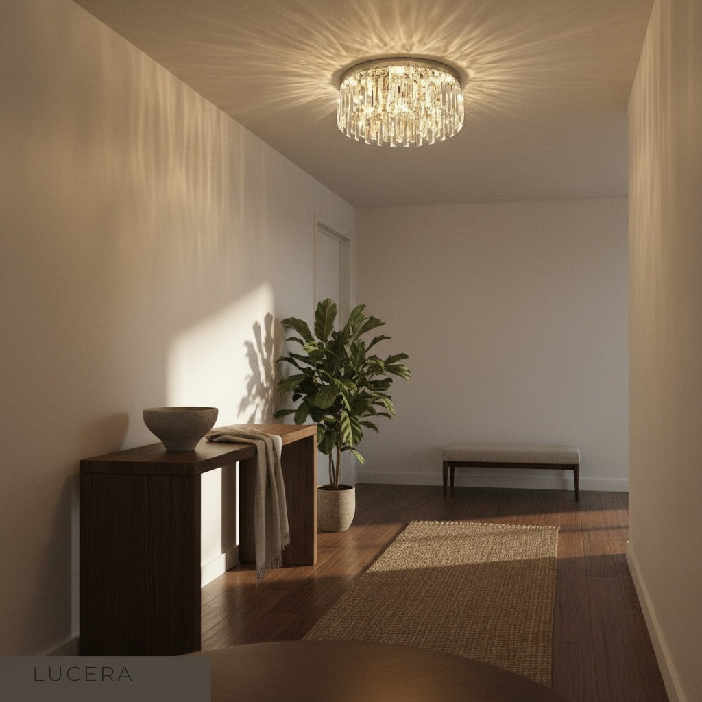 studio shot of Lucera Emeraldine ceiling light with stainless steel frame and crystal bars on white background
